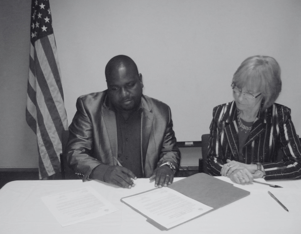 crudoc partnership photo- project signing ceremony with america ambassador.
