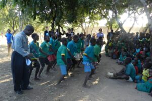 Pupils dancing at the school library in Malawi launching ceremony