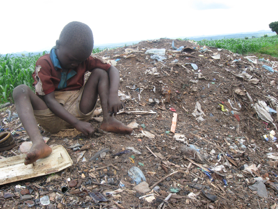 A young child among the child scavengers in Malawi who still visit the dumpsites