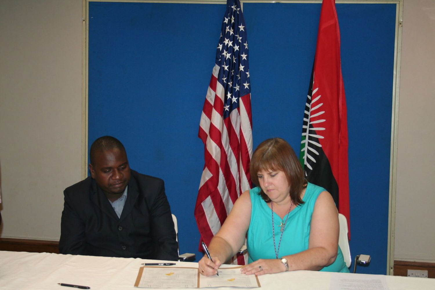 Signing ceremony for a school library in Malawi with USAID and CRIDOC